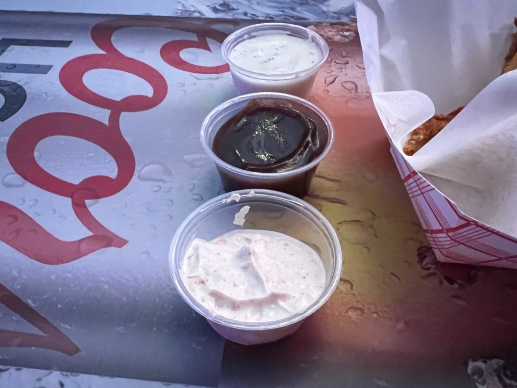 Three side sauces in a row: zesty (white), barbecue (dark brown), and ranch (white).