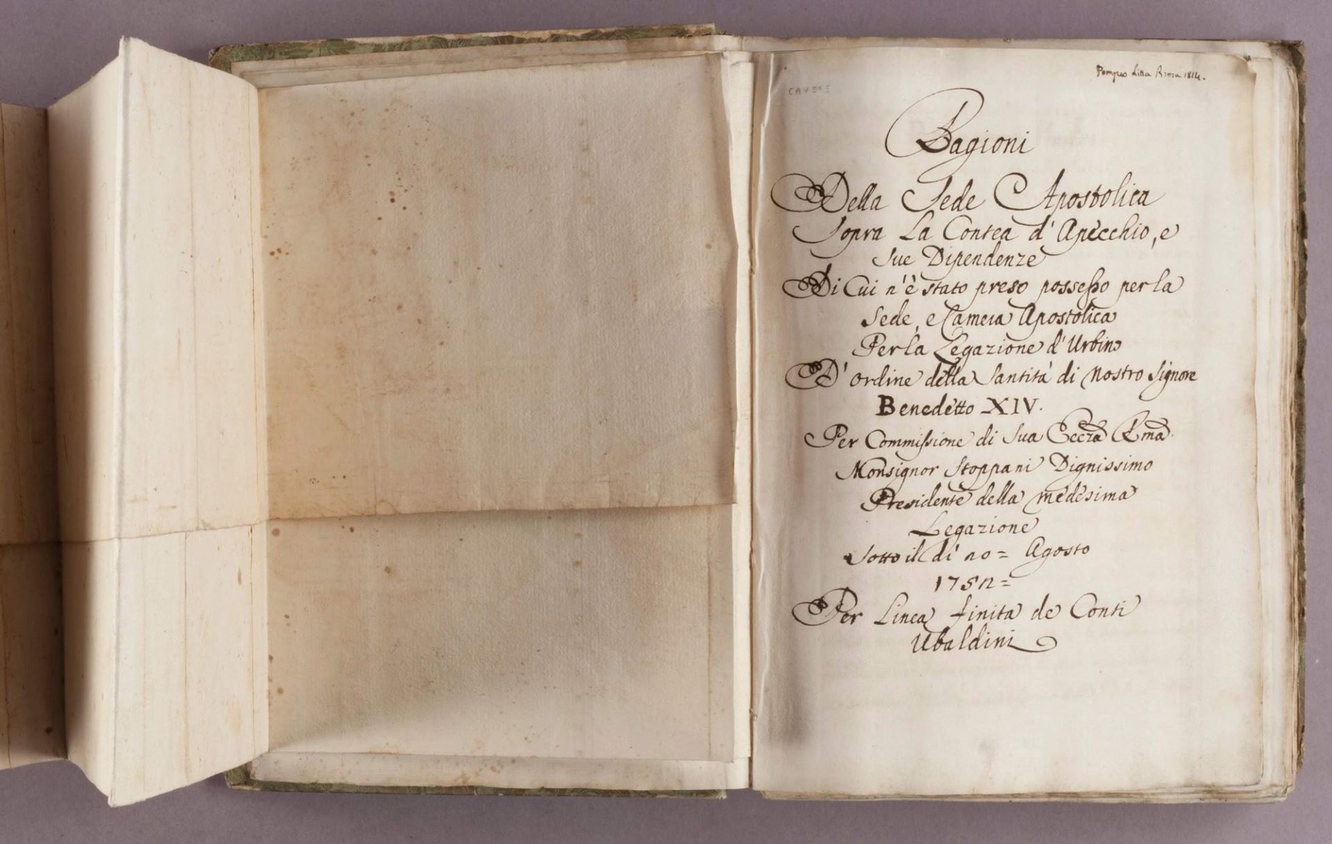 A manuscript book laid out with cursive writing on the pages