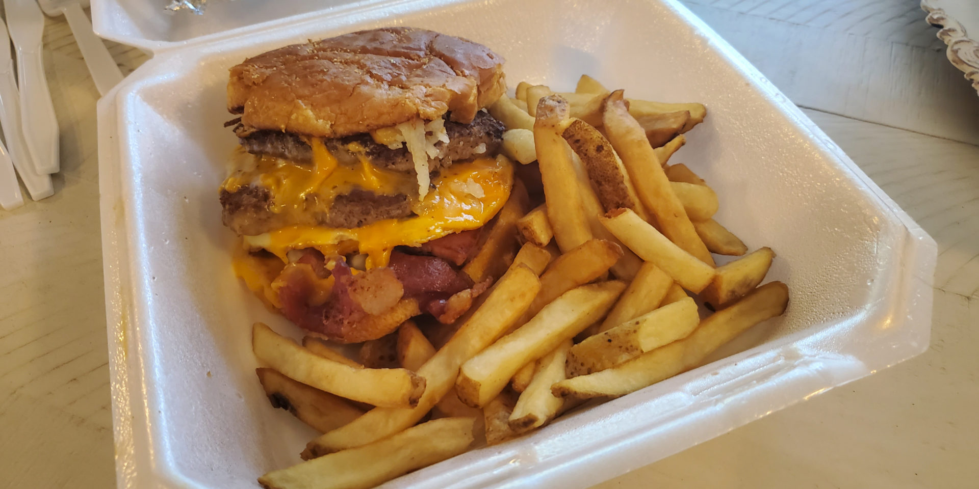 A takeout burger and fries from Four Breakfast & More in Champaign.